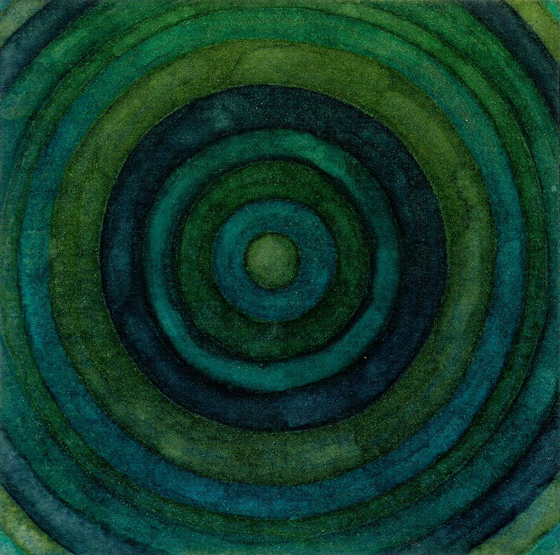 Dibujo de acuarela con círculos concéntricos en colores verdes y azules.